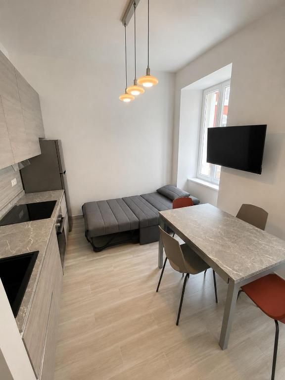 Living area with the sofa bed open at Casa dei Greghi